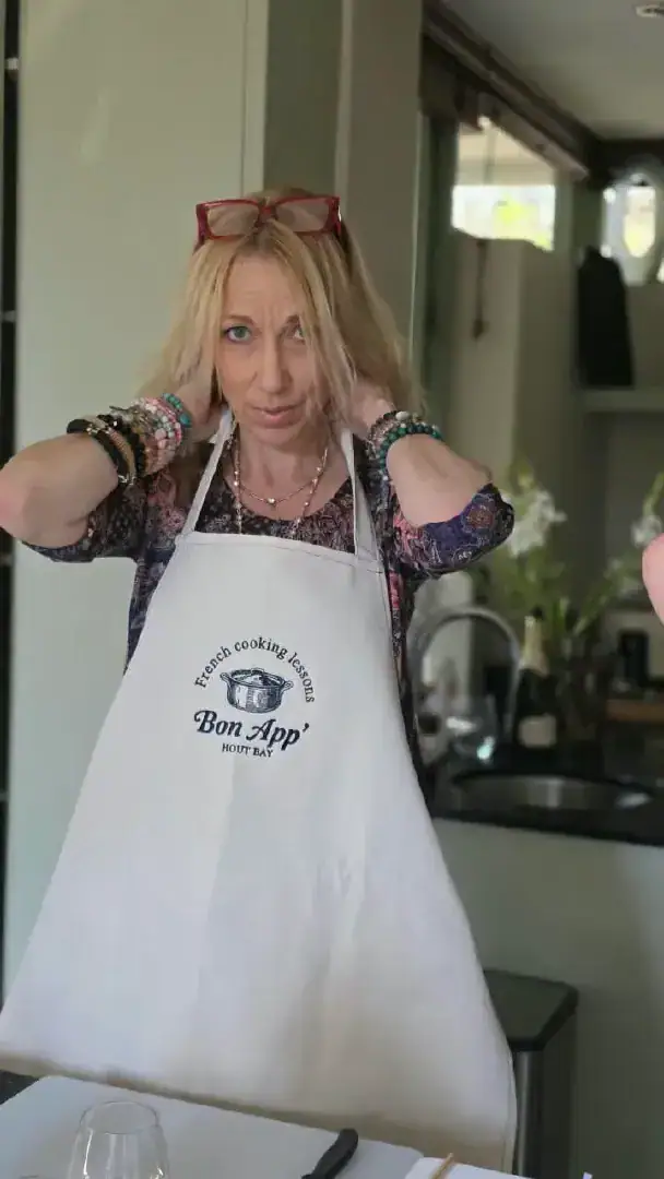 A guest having fun in an apron