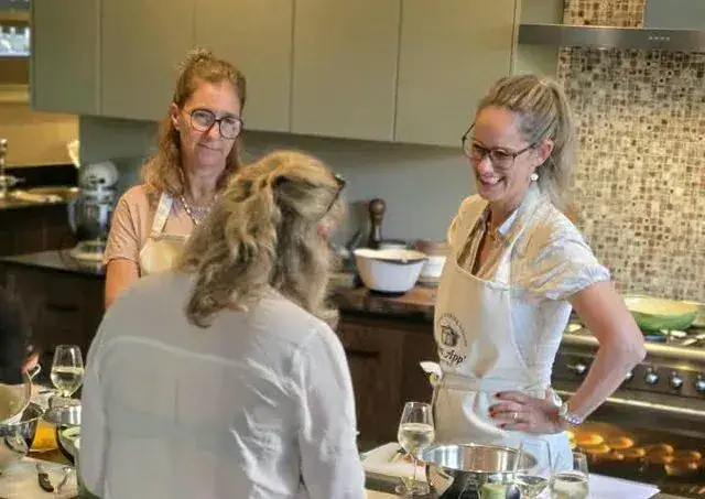 Two guests at the kitchen island